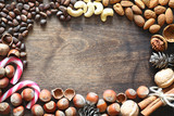 Fototapeta Desenie - Different nuts on a wooden table. Cedar, cashew, hazelnut, walnu