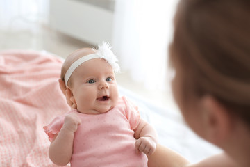 Poster - Loving mother with her baby, closeup