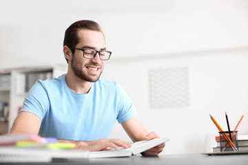 Canvas Print - Student studying at table indoors