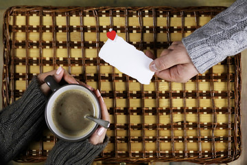 Wall Mural - man presents girl drinks coffee gift on Valentine's Day