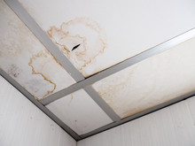 Ceiling Panels Damaged Hole In Roof Restroom, Dirty Concept.