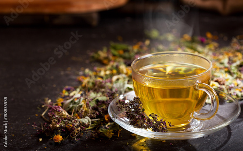 Cuadros en Lienzo Cup of herbal tea with various herbs
