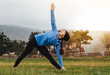 © _KUBE_ - attractive sports girl does the bends to warm up before you run