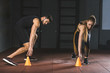 © LIGHTFIELD STUDIOS - Young athletes running and touching training cones in sports center
