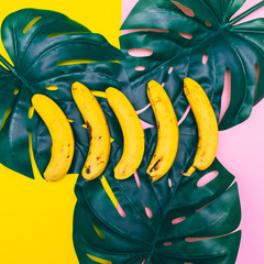 Poster - a handful of bananas are lying in line on palm leaves. geometric pastel minimal concept of food