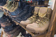 © DmyTo - Army boots are in line at the store counter. Shoes