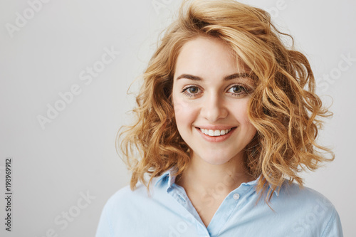 Headshot Of Attractive Female Coworker In Blue Blouse With Short