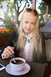 © tugolukof - woman in street cafe