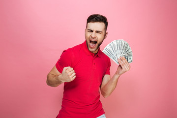 Poster - Portrait of a happy young man holding money