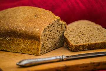 loaf of fresh bread on wooden surface.food closeup.