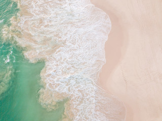 Wall Mural - Top view of beautiful white sand beach and turquoise sea water, aerial drone shot. Amazing nature background.