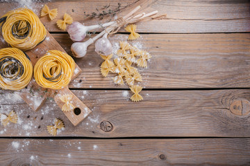 Wall Mural - Raw homemade pasta with flour, garlic and spices