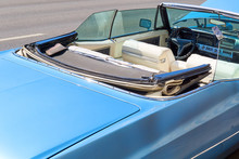 The Car Is A Convertible Without A Driver With An Open Roof, Parked On The Road