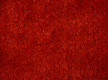 Close-up Of The Red Carpet Texture Background And Wallpaper In The Room.The Texture Of Red Fabric Textile Carpet.