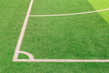 Wall Mural - The white Line marking on the artificial green grass soccer field