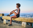 © Joshua Resnick - fit african woman woman resting on bench at runyon canyon shortly after sunset