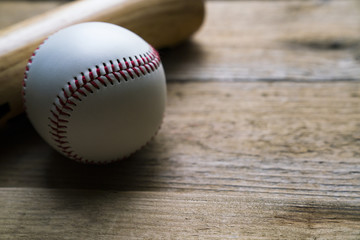 Wall Mural - baseball and baseball bat on wooden table background, close up