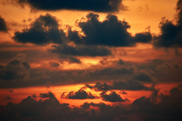  Sunset Clouds. Dramatic sunset in orange sunlight. Flaming sunset with light passing through the dark clouds. Landscape.