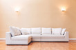 White sectional couch in a large luxury interior home