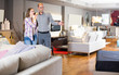 © JackF - Family couple visiting salon of furniture in search of new couch