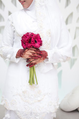 Wall Mural - Wedding flowers ,Woman holding colorful bouquet with her hands on wedding day. Selective focus.