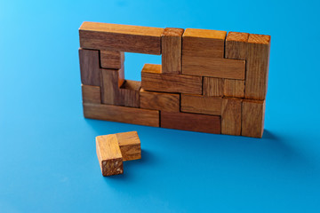 Geometric wooden blocks on blue nacground