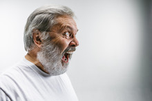 The Senior Emotional Angry Man Screaming On White Studio Background