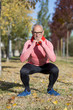 © 2Design - Senior man stretching after jogging in the park