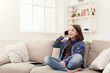 © Prostock-studio - Young girl at home talking on mobile phone