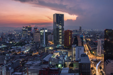 Fototapete - Aerial view of mexico city downtown skyscrappers at sunset time before night.