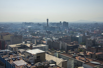 Fototapete - Aerial view of a neighborhood called Colonia Juarez in Mexico City, Mexico, on a sunny morning with some haze.