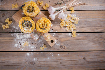 Wall Mural - Raw homemade pasta with flour, garlic and spices