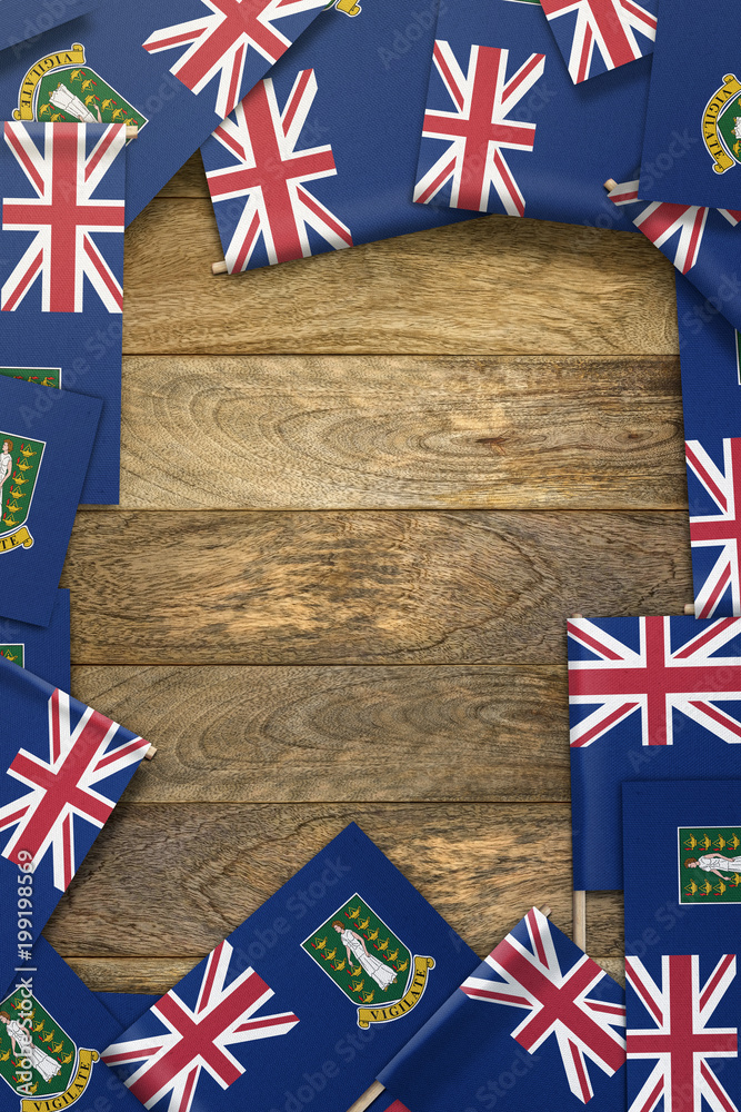 British Vergin Islands small flags framing a wood texture background ...