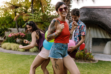 Wall Mural - Happy woman enjoying with friends playing games