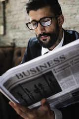 Wall Mural - Businessman reading newspaper