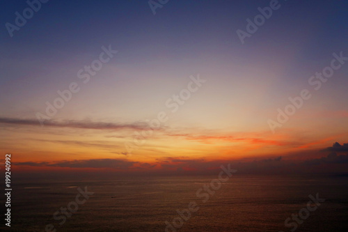 Obraz Dibond orange sunset, landscape of sky and clouds in evening, background of sun sets over horizon Adaman Sea, amazing light. oncept of nature, harmony and travel