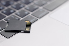 Micro SD Card On Keyboard Computer Or Laptop