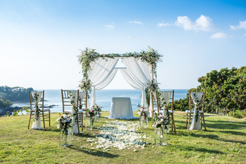 Wall Mural - Romantic wedding ceremony on the lawn Sea view.