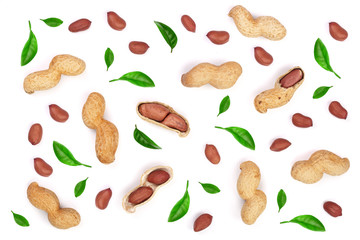 Wall Mural - Peanuts decorated with green leaves isolated on white background, top view. Flat lay pattern