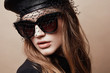 © monchak - Fashion portrait of beautiful young woman in black cap and dark sunglasses with veil