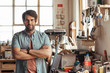 © mavoimages - Confident young woodworker standing by a bench in his workshop
