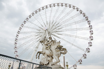 Wall Mural - statue and ferris wheel in Paris, France