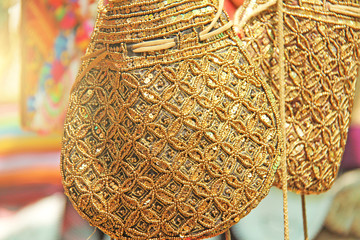 Wall Mural - Bright national Indian colored bags are sold in the market of bazaars in India, Goa. Souvenirs Gifts India. Hand embroidery in gold