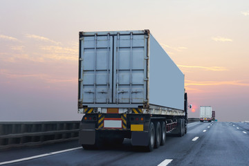 Truck on highway road with container, transportation concept.,import,export logistic industrial Transporting Land transport on the asphalt expressway with sunrise sky