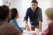 © jackfrog - in a meeting. A young man presenting his project