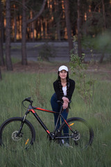 Wall Mural - Female cyclist in the woods.