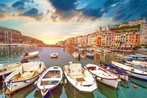 The magical landscape of the harbor with colorful houses in the boats in Port...