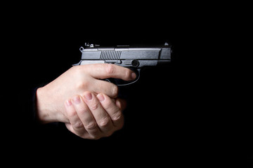 A firearm in the hands of a man defending or attacking