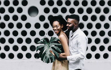 Young african man looking at his girlfriend