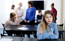 Girl Student Being Shy Among Classmates